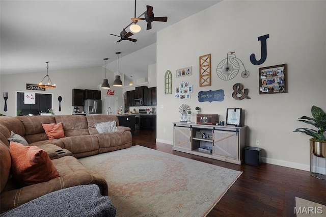 234 Lonepine Dr, Wentzville, MO 63385 - living room featuring vaulted ceiling, dark wood-style flooring, a ceiling fan, and a chandelier