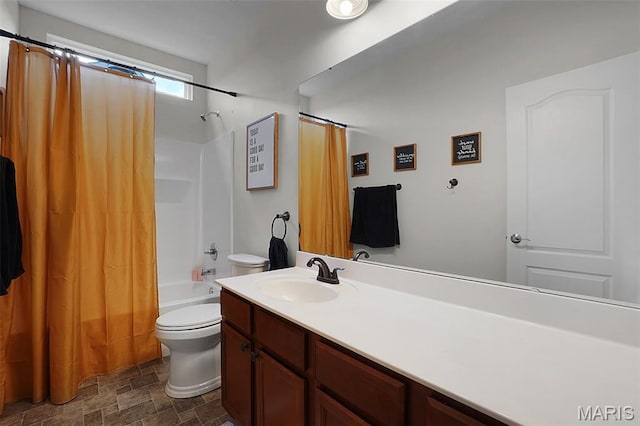 234 Lonepine Dr, Wentzville, MO 63385 - bathroom featuring shower / bath combo with shower curtain, vanity, and stone finish flooring