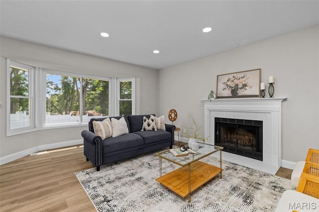 145 Aspencade Cir, Saint Peters, MO 63376 - living room with wood finished floors, recessed lighting, and a fireplace with flush hearth