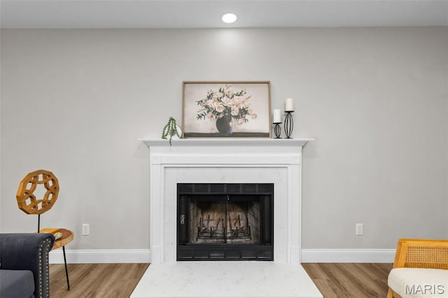 145 Aspencade Cir, Saint Peters, MO 63376 - detailed view of wood finished floors, a premium fireplace, and recessed lighting