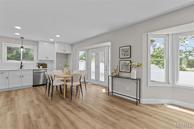 145 Aspencade Cir, Saint Peters, MO 63376 - dining area with healthy amount of natural light, light wood-type flooring, and recessed lighting