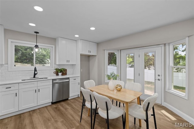 145 Aspencade Cir, Saint Peters, MO 63376 - kitchen featuring dishwasher, healthy amount of natural light, white cabinetry, and recessed lighting