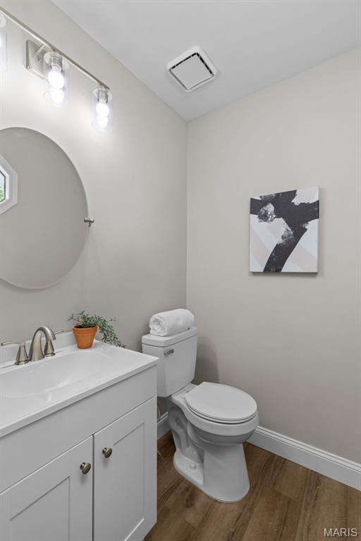 145 Aspencade Cir, Saint Peters, MO 63376 - half bath featuring wood finished floors and vanity