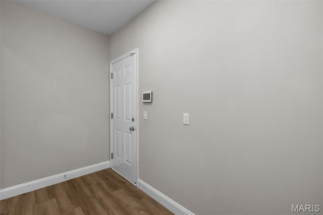 145 Aspencade Cir, Saint Peters, MO 63376 - laundry area with wood finished floors and baseboards