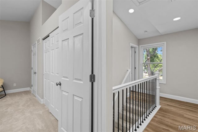 145 Aspencade Cir, Saint Peters, MO 63376 - corridor featuring recessed lighting, lofted ceiling, and an upstairs landing