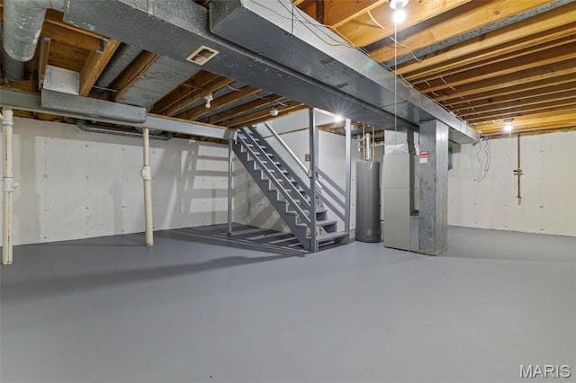 145 Aspencade Cir, Saint Peters, MO 63376 - unfinished below grade area with heating unit, stairway, and gas water heater