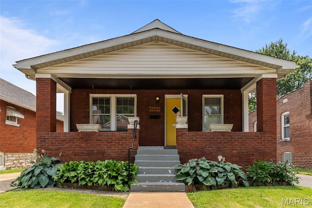 5524 Devonshire Ave, Saint Louis, MO 63109 - bungalow-style house with covered porch and brick siding