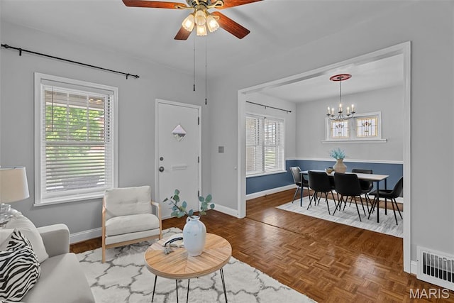 5524 Devonshire Ave, Saint Louis, MO 63109 - living area featuring a chandelier and ceiling fan