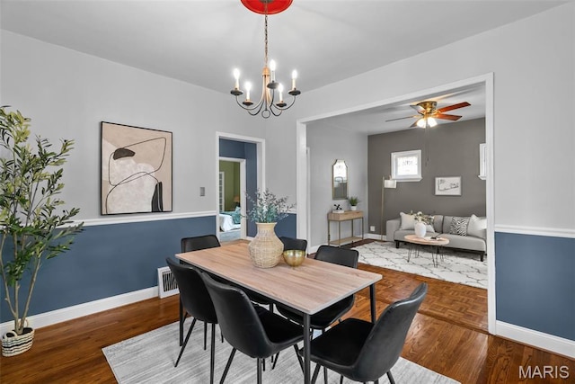 5524 Devonshire Ave, Saint Louis, MO 63109 - dining area with a chandelier, ceiling fan, and wood finished floors