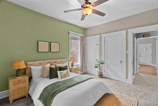 5524 Devonshire Ave, Saint Louis, MO 63109 - bedroom featuring light carpet, ceiling fan, and light tile patterned floors