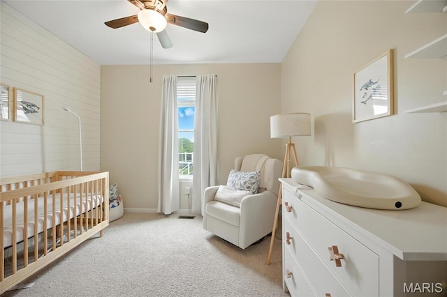 213 Dell View Dr, Arnold, MO 63010 - bedroom with a crib, light colored carpet, wooden walls, and ceiling fan