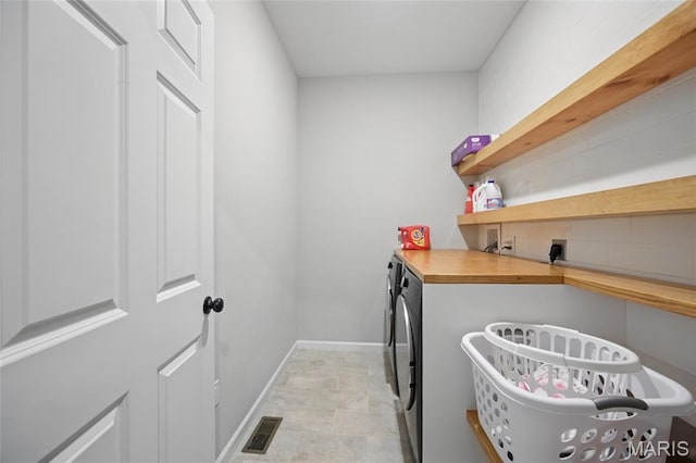 213 Dell View Dr, Arnold, MO 63010 - washroom with washing machine and clothes dryer and baseboards