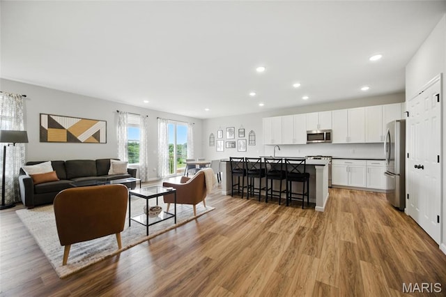 213 Dell View Dr, Arnold, MO 63010 - living room with recessed lighting and light wood-type flooring