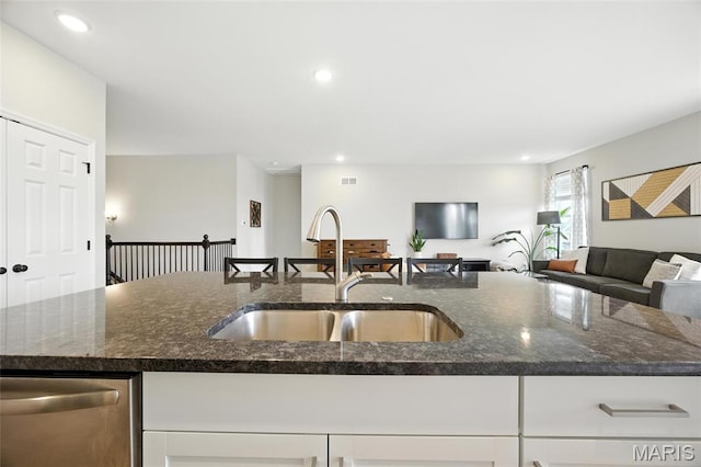 213 Dell View Dr, Arnold, MO 63010 - kitchen featuring dishwasher, dark stone counters, white cabinets, open floor plan, and recessed lighting