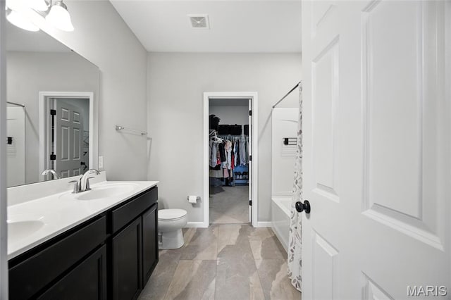 213 Dell View Dr, Arnold, MO 63010 - bathroom featuring double vanity, a spacious closet, and  shower combination
