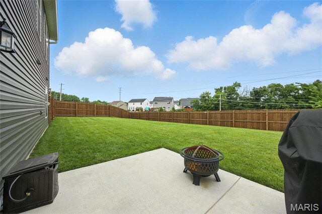 213 Dell View Dr, Arnold, MO 63010 - fenced backyard with an outdoor fire pit, a patio area, and area for grilling