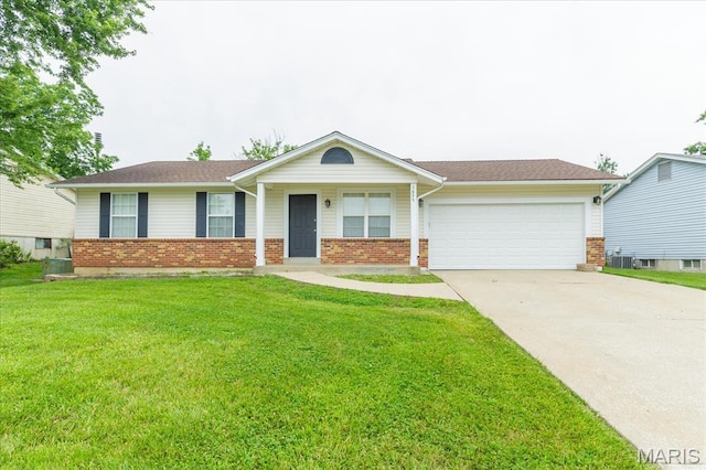 1655 Oakwood Dr, Ofallon, MO 63366 - ranch-style house featuring brick siding, a garage, concrete driveway, and a front yard