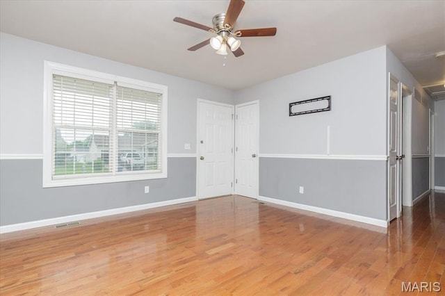 1655 Oakwood Dr, Ofallon, MO 63366 - spare room featuring wood finished floors and ceiling fan