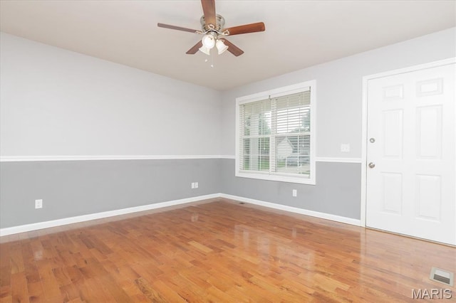 1655 Oakwood Dr, Ofallon, MO 63366 - empty room with a ceiling fan and wood finished floors