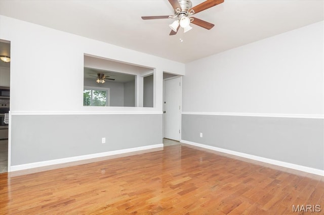 1655 Oakwood Dr, Ofallon, MO 63366 - empty room featuring ceiling fan and wood finished floors