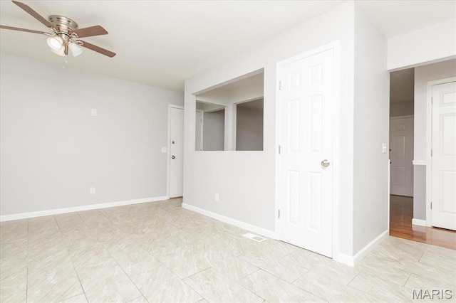 1655 Oakwood Dr, Ofallon, MO 63366 - spare room with ceiling fan and light tile patterned flooring