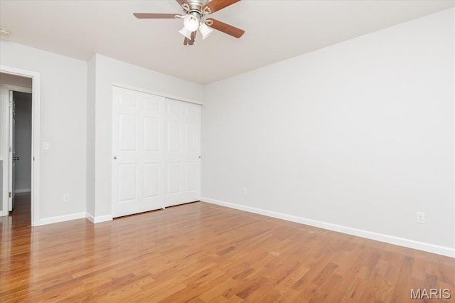 1655 Oakwood Dr, Ofallon, MO 63366 - unfurnished bedroom featuring light wood-style floors, a closet, and a ceiling fan