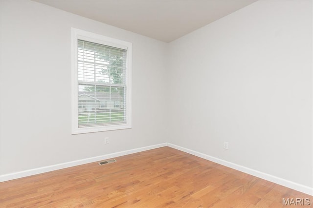 1655 Oakwood Dr, Ofallon, MO 63366 - unfurnished room featuring baseboards and light wood-type flooring