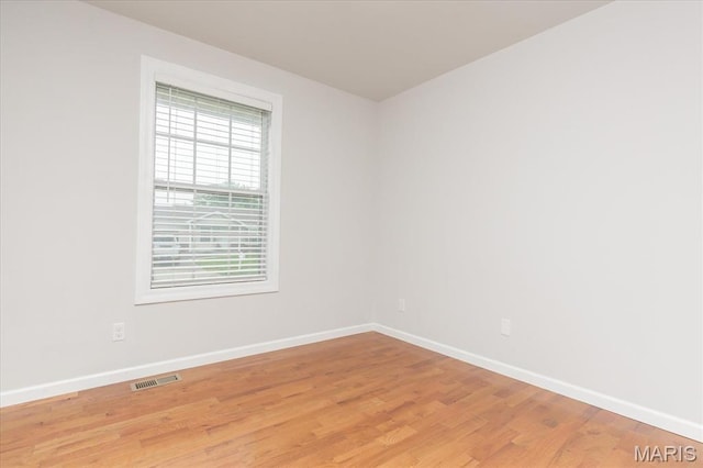 1655 Oakwood Dr, Ofallon, MO 63366 - unfurnished room featuring baseboards and light wood-style floors