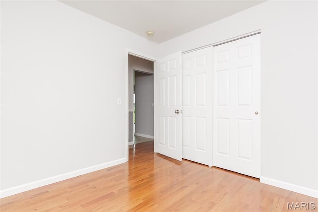 1655 Oakwood Dr, Ofallon, MO 63366 - unfurnished bedroom featuring light wood-style flooring and a closet