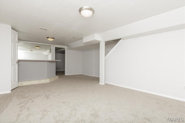 1655 Oakwood Dr, Ofallon, MO 63366 - unfurnished living room featuring carpet and a dry bar