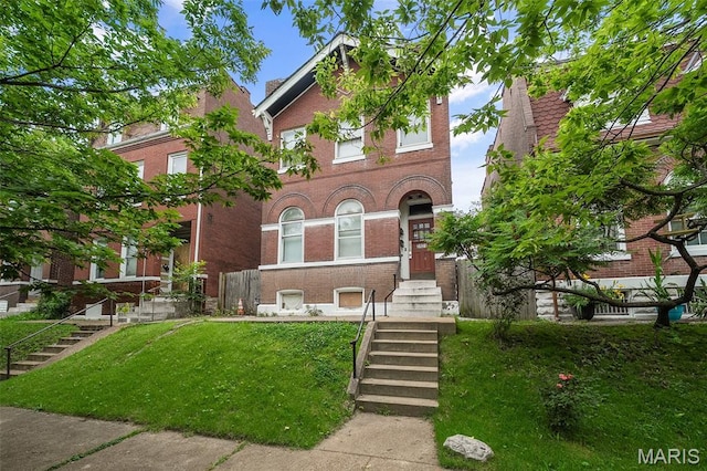 3921 Pennsylvania Ave, Saint Louis, MO 63118 - view of front of home with brick siding and a front lawn