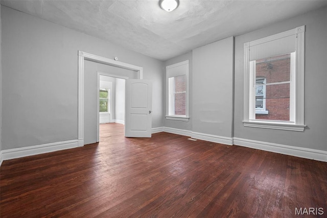 3921 Pennsylvania Ave, Saint Louis, MO 63118 - empty room featuring dark wood-style flooring