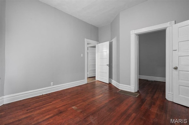 3921 Pennsylvania Ave, Saint Louis, MO 63118 - unfurnished bedroom with wood finished floors and a spacious closet