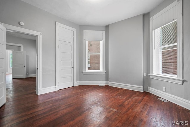 3921 Pennsylvania Ave, Saint Louis, MO 63118 - unfurnished bedroom with dark wood finished floors and a closet