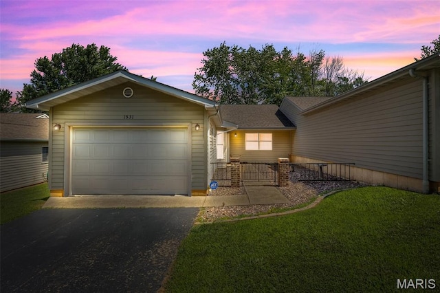 1531 Charmaine Dr, Bonne Terre, MO 63628 - view of front facade with asphalt driveway, a garage, and a front yard