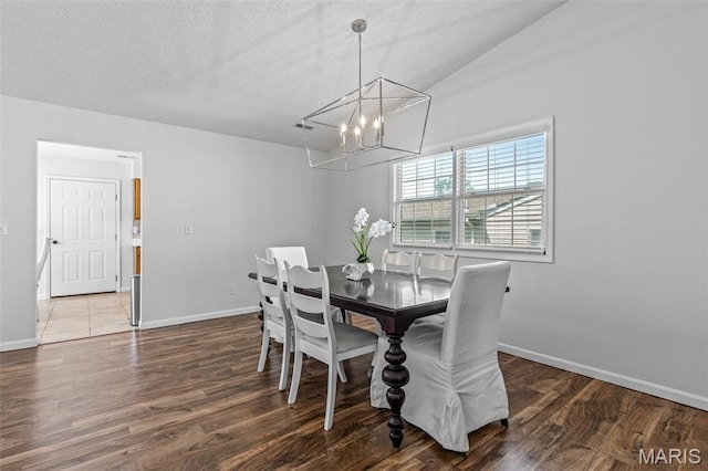 1531 Charmaine Dr, Bonne Terre, MO 63628 - dining space featuring a chandelier, wood finished floors, and a textured ceiling
