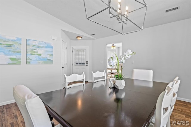 1531 Charmaine Dr, Bonne Terre, MO 63628 - dining space featuring wood finished floors, lofted ceiling, and a chandelier