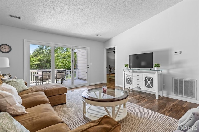 1531 Charmaine Dr, Bonne Terre, MO 63628 - living area featuring wood finished floors and a textured ceiling