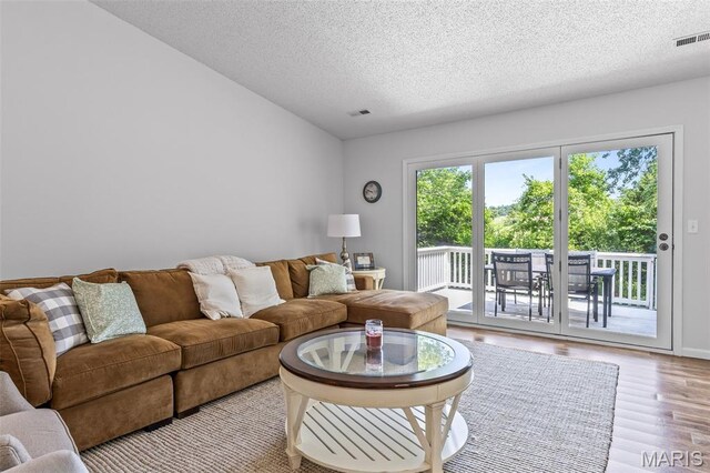 1531 Charmaine Dr, Bonne Terre, MO 63628 - living room with a textured ceiling and wood finished floors