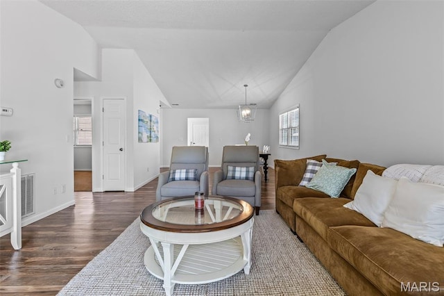 1531 Charmaine Dr, Bonne Terre, MO 63628 - living area featuring wood finished floors, high vaulted ceiling, and a chandelier