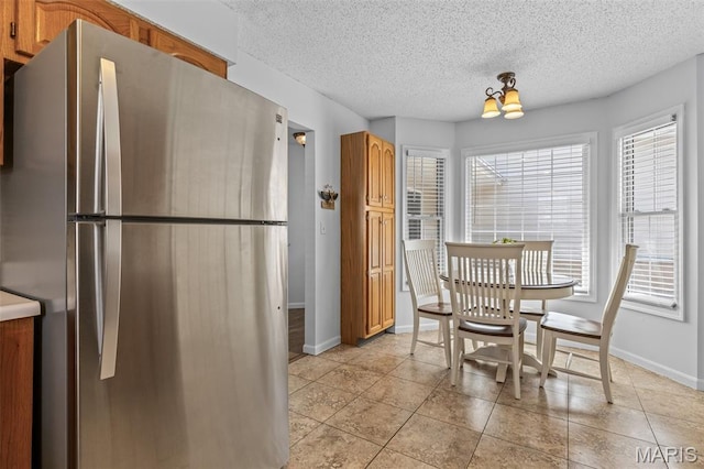 1531 Charmaine Dr, Bonne Terre, MO 63628 - dining room with a textured ceiling and light tile patterned floors