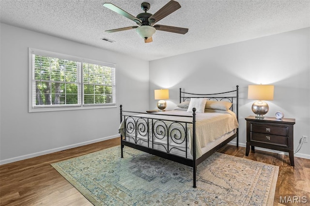 1531 Charmaine Dr, Bonne Terre, MO 63628 - bedroom featuring wood finished floors, a textured ceiling, and ceiling fan