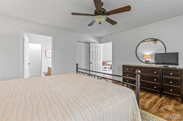 1531 Charmaine Dr, Bonne Terre, MO 63628 - bedroom with wood finished floors, connected bathroom, a closet, ceiling fan, and a textured ceiling