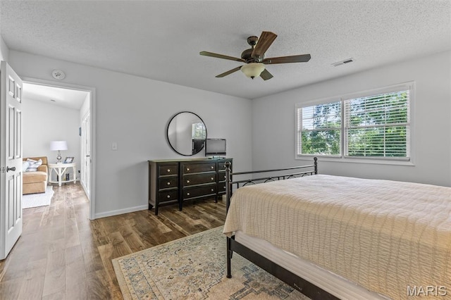 1531 Charmaine Dr, Bonne Terre, MO 63628 - bedroom with wood finished floors, a textured ceiling, and ceiling fan