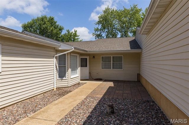 1531 Charmaine Dr, Bonne Terre, MO 63628 - view of exterior entry featuring a patio and roof with shingles