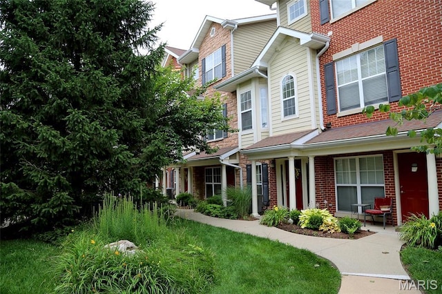 2636 S Mcknight Rd, Rock Hill, MO 63124 - view of front facade featuring brick siding and a porch