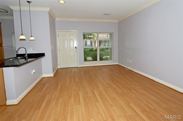 2636 S Mcknight Rd, Rock Hill, MO 63124 - unfurnished living room with light wood-style floors and ornamental molding