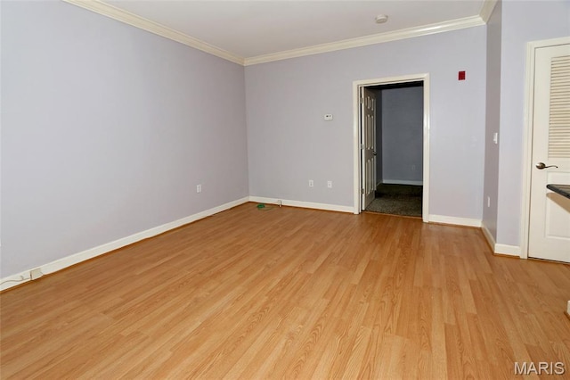 2636 S Mcknight Rd, Rock Hill, MO 63124 - empty room with light wood-style floors and ornamental molding