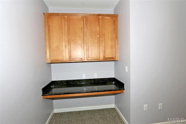 2636 S Mcknight Rd, Rock Hill, MO 63124 - kitchen with dark stone countertops and carpet
