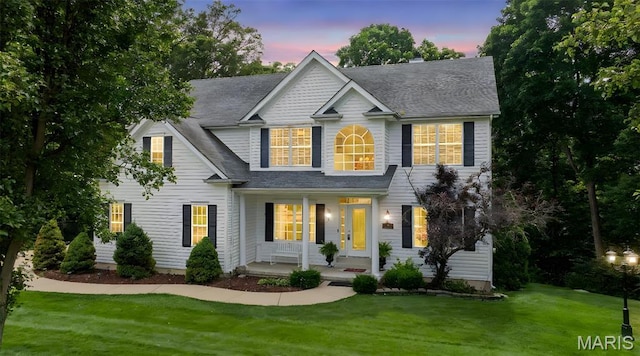 5 Hickory Glen Ct, Lake St Louis, MO 63367 - view of front of property featuring a porch, a yard, and roof with shingles